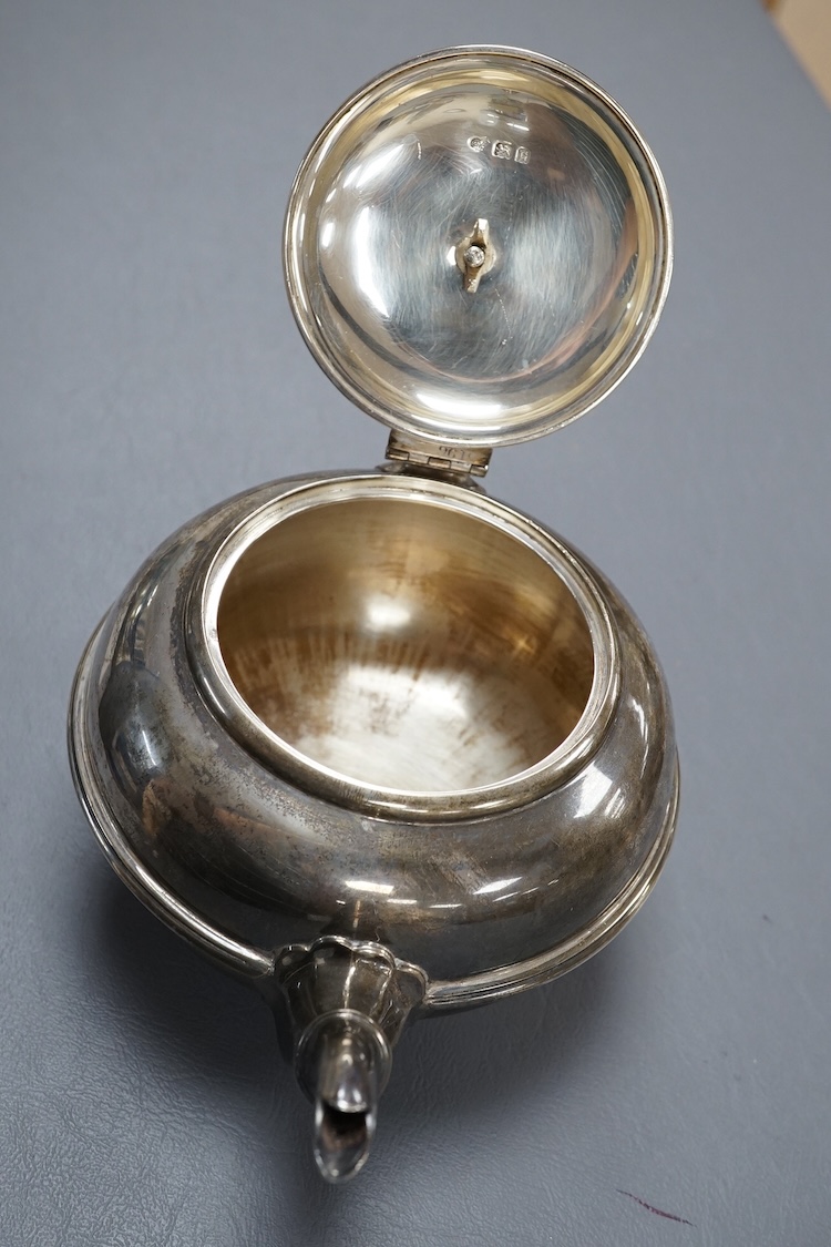 A George V silver circular teapot, by Goldsmiths & Silversmiths Co Ltd, London, 1918, gross 17.5oz.